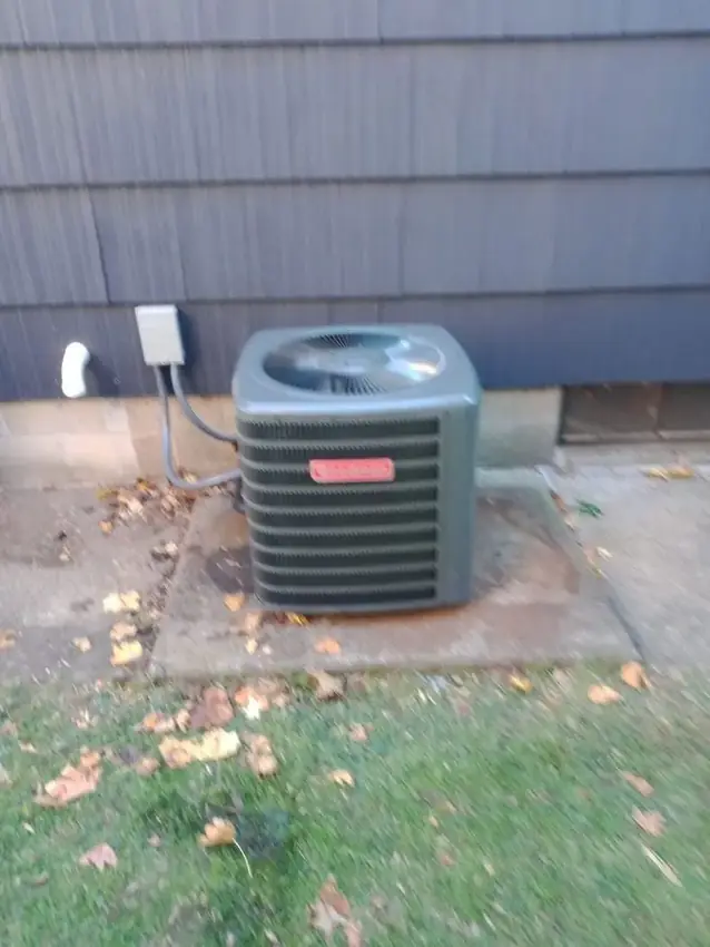 HVAC condenser installed outside a home